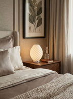 LumiSpiral 3D printed spiral bedside lamp with warm ambient light, designed and made in New Zealand