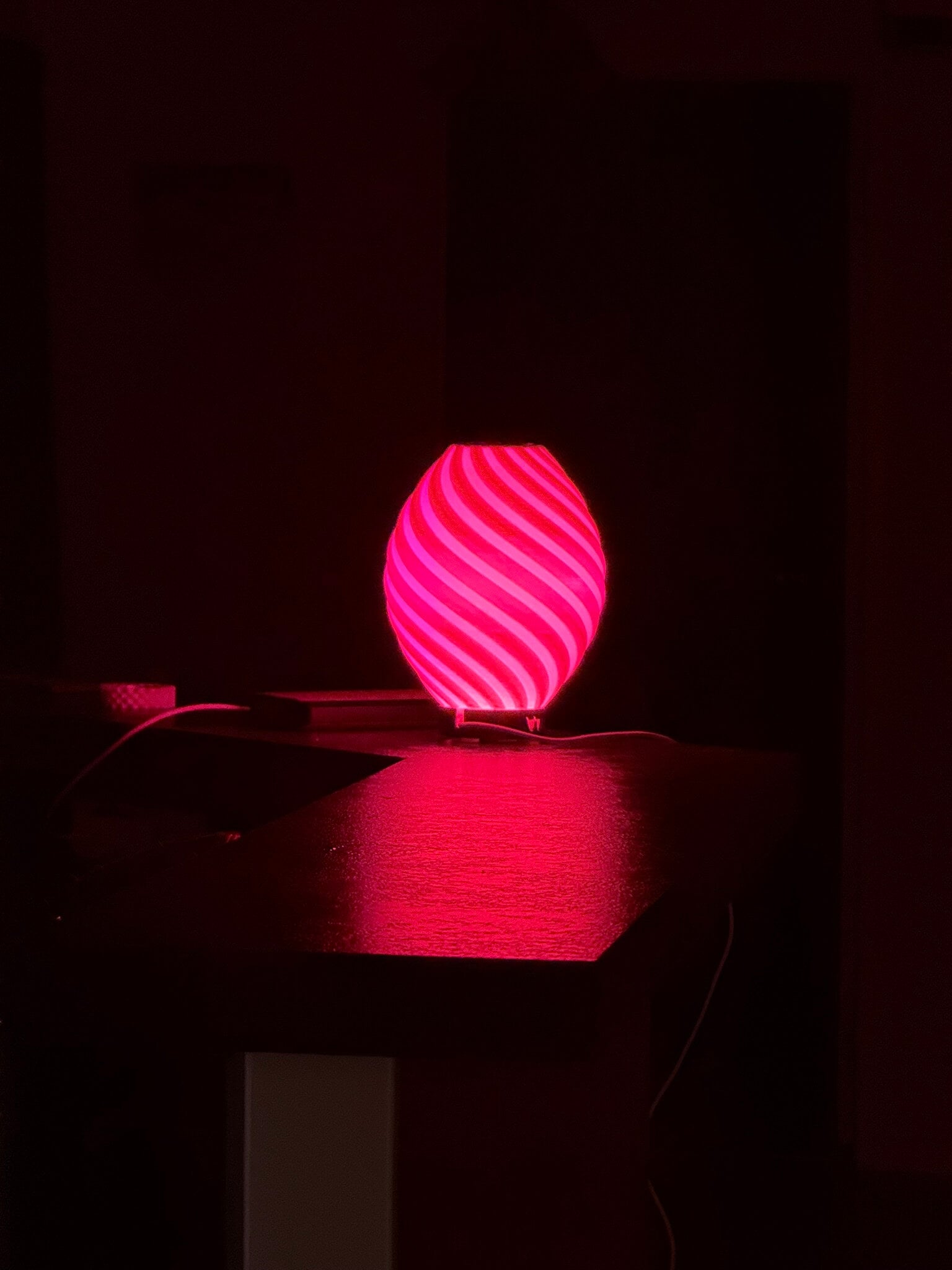 Pink glowing orb on a dark background